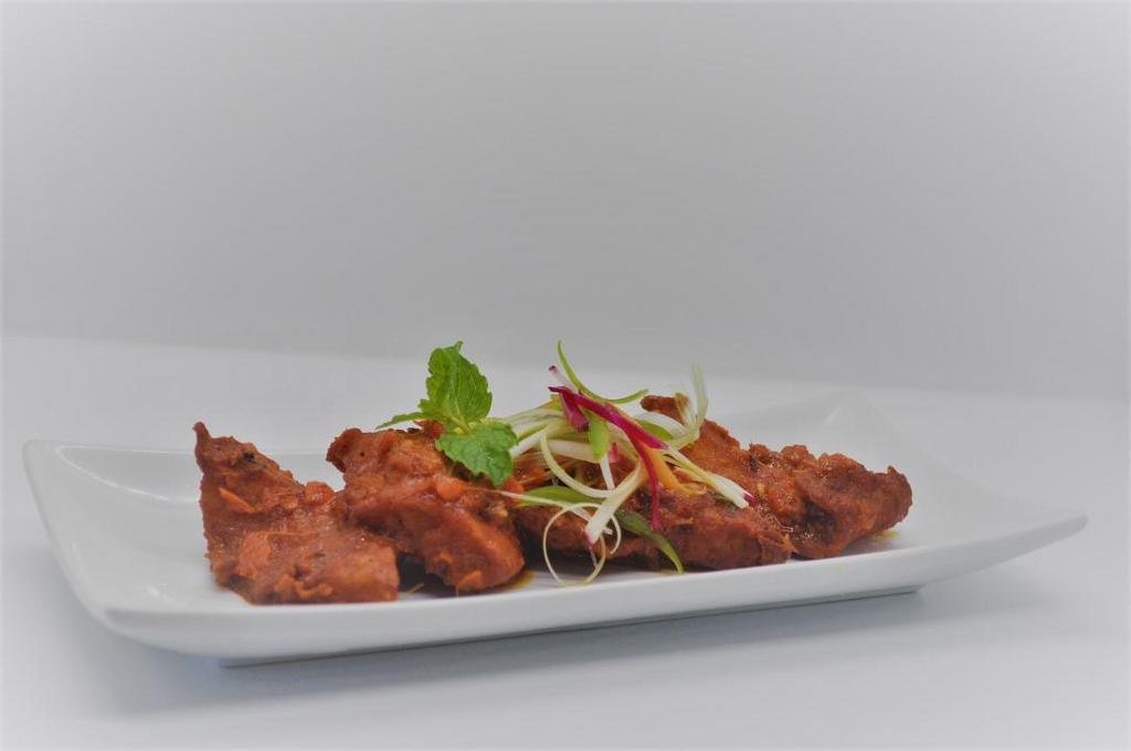 APOLLO FISH · Delicious boneless bass fish fried with curry leaves for a mouth watering flavor