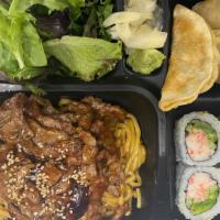 Beef Bento · 810 cal. Served with steamed rice, four pieces California roll, three pieces dumplings and m...