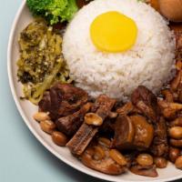 Coke Pig's Feet with Peanut Rice Box · Includes: House-made Sour Cabbage, side of vegetables, Stewed Chicken Egg, and Minced Pork S...