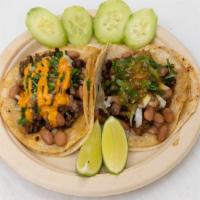 Margarita Tacos · white corn tortilla, choice of meat, cilantro, beans, and mix salsa *Salsa is a mix of all u...