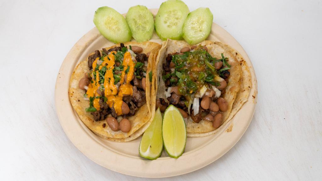 Margarita Tacos · white corn tortilla, choice of meat, cilantro, beans, and mix salsa *Salsa is a mix of all unless a specific salsa is requested otherwise*