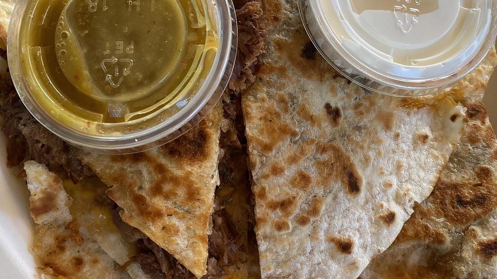 Quesadilla Grande · Choice of meat, sour cream, and salsa