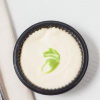 Key Lime Cheesecake · Shortbread cookie crust, key lime cheesecake filling. Topped with classic cheesecake and rib...