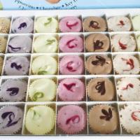 Charlie's Poppers Party Pack - 105 pc case · 1 oz bite sized cheesecakes. Assorted flavors.