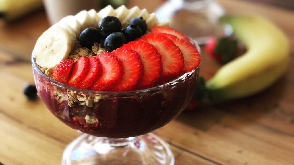 Small Açaí Bowl · Made from a blend of acai berries and guaraná. Served with granola, bananas, strawberries, and blueberries.