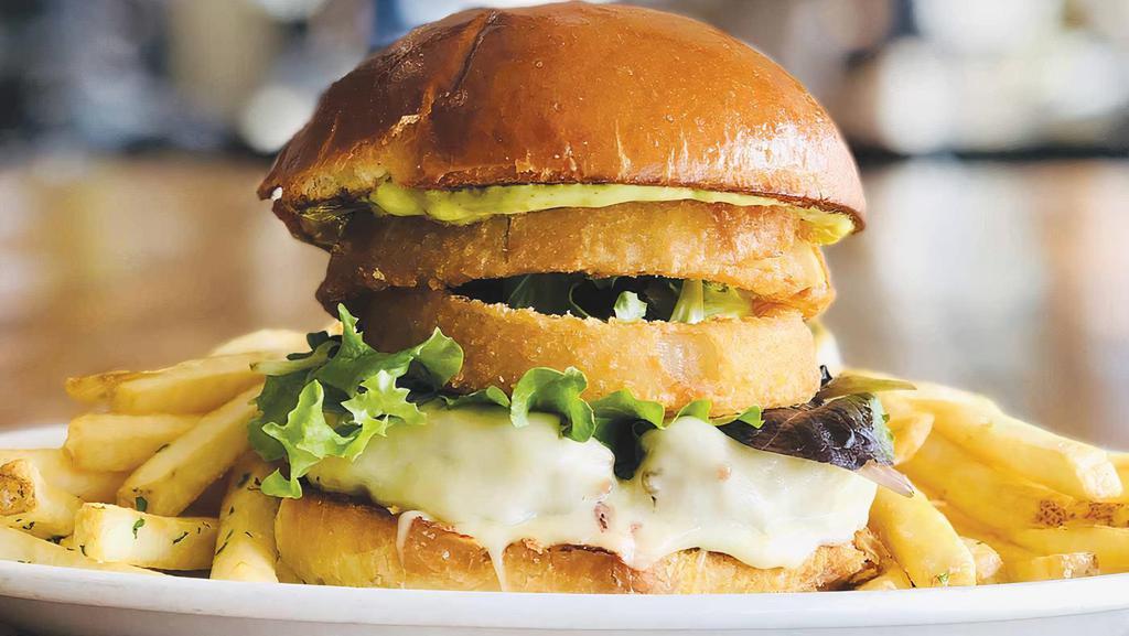 Pompéia Burger · 6oz grass fed burger with gouda cheese, cilantro mayonnaise, spring mix and onion rings on a brioche bun