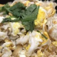 Crab Fried Rice · Jasmine rice pan fired with special crab meat, egg, green peas, carrots and green onions.