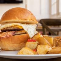 Breakfast Burger · Pork sausage patties, bacon, fried egg, and cheddar on housemade bun.