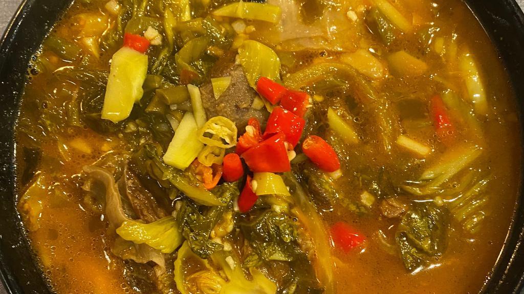 酸菜牛腩面 / Beef & Pickled	Mustard Greens Noodle Soup · Tangy and savory flavors.
