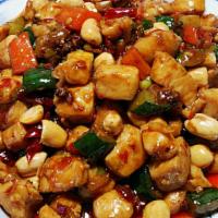 宫保鸡丁 / Kong Pao Chicken · Spicy. Stir- fried chicken with peanuts, red pepper and soy sauce.
