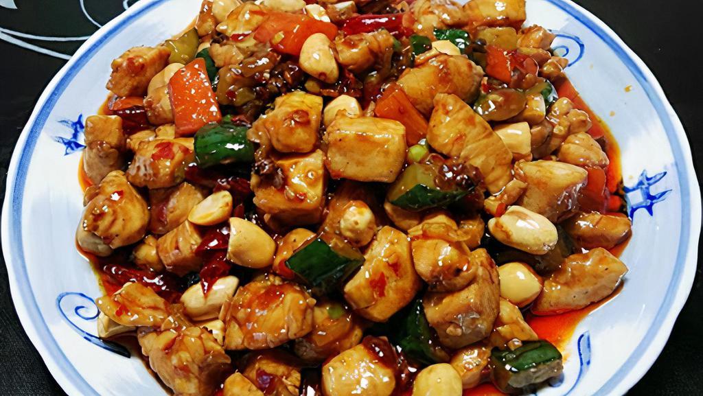 宫保鸡丁 / Kong Pao Chicken · Spicy. Stir- fried chicken with peanuts, red pepper and soy sauce.