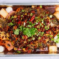 烤全鱼 / Grilled Whole Fish · Spicy. Numbing spicy with assorted vegetables,beef tripes, quail eggs, fish balls.