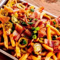 Dirty Fries · hand cut kennebec fries with beer  cheese sauce, hobbs bacon, pickled  jalapeño, and green o...