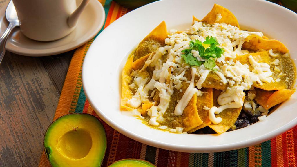 Chilaquiles (Green or Red Salsa) · Your choice of red or green sauce.  Fried corn tortillas with salsa, queso fresco, sour cream and black beans.