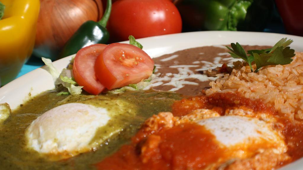 Huevos Rancheros · Two eggs on a fried corn tortilla topped with your choice of green or red sauce. Served with rice, beans, and cheese.