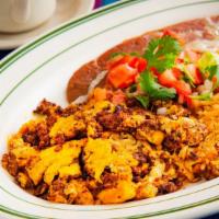 Huevos Con Chorizo · Two scrambled eggs with Mexican chorizo sausage, with rice and beans