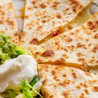 Meat Quesadilla · Large flour tortilla with cheese and meat.   Guacamole and sour cream on the side