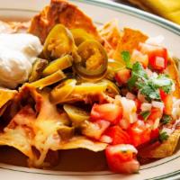 Nachos · Fresh chips with refried beans, cheese, red sauce, pico de gallo, sour cream, jalapeños, and...