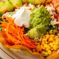 Taco Salad · Choice of meat. Fried flour tortilla shell, beans, cheese, lettuce, pico de gallo, carrots, ...
