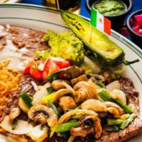 Carne Asada · Thinly cut N.Y. steak grilled with sautéed mushrooms, onions, green onions, guacamole, and t...