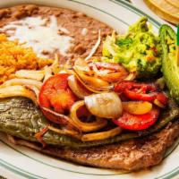 Carne Asada a la Mexicana · Our grilled carne asada accompanied by nopales, onions, tomatoes, guacamole, and roasted jal...