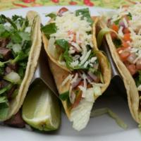 Mexican taco a la carta · Corn tortilla filled with choice of meat, cilantro and onions