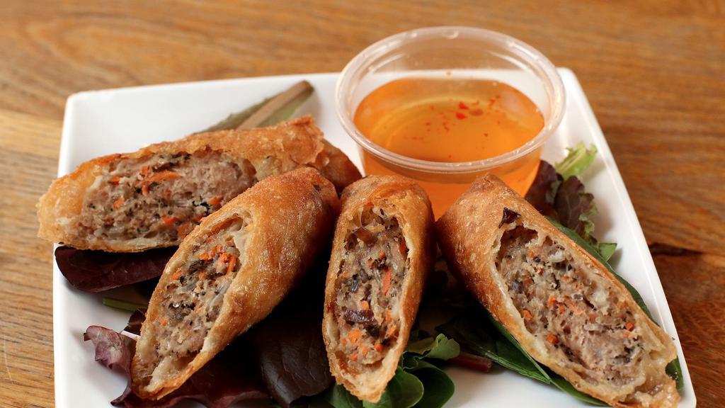 Momma Tran’s Crispy Egg Rolls · Ground pork, woodear mushrooms, glass noodles, shredded carrots, and onions served with nuoc cham dipping sauce. Two egg rolls per order.