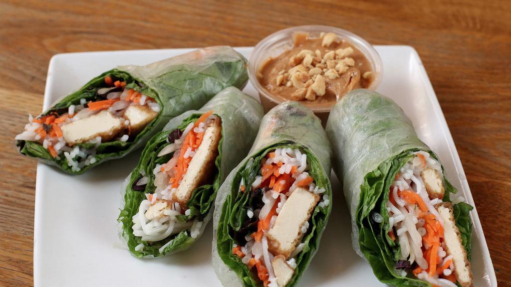 Tofu Rolls · Organic, gluten free tofu slices, vermicelli noodles, shredded carrots, mango, lettuce, and fresh herbs wrapped in rice paper and served with your choice of regular or spicy peanut dipping sauce. Two rolls per order.