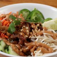 Saigon Peanut Rice Bowl · Papaya, pickled carrots and daikon, jalapenos, bean sprouts, and spicy cucumbers, topped wit...
