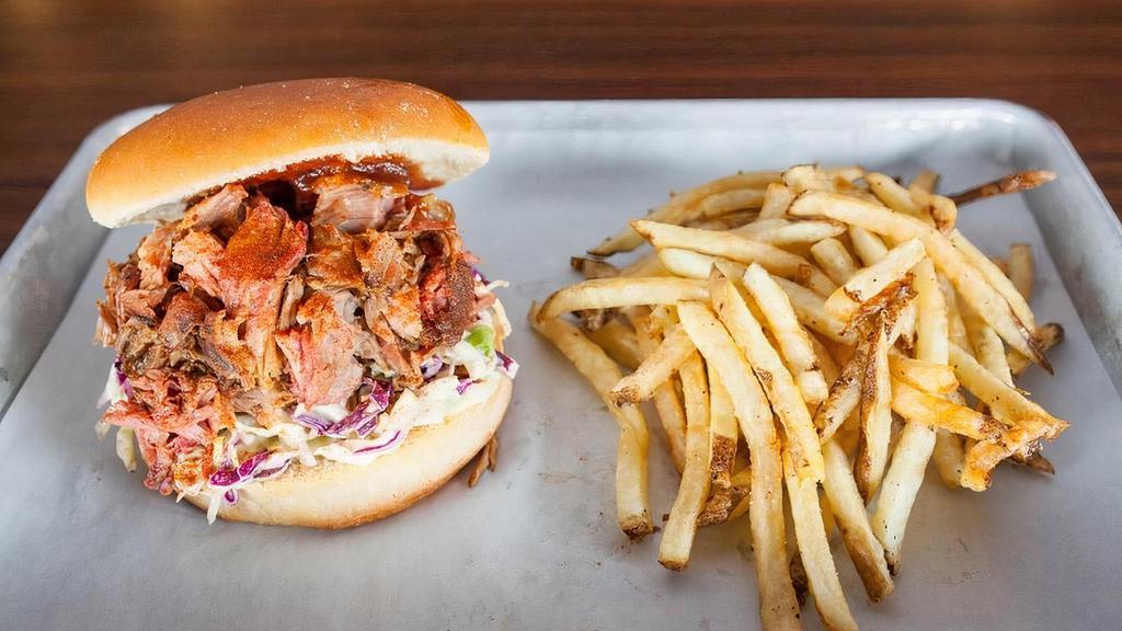 Pulled Pork Sammy · Slow smoked, 12-hour pulled pork, topped with housemade slaw and a dab of our special honey BBQ sauce.
