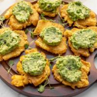 TOSTONES WITH GUACAMOLE (8 PIECES) · Green Plantain Tostones Topped With Fresh Guacamole.