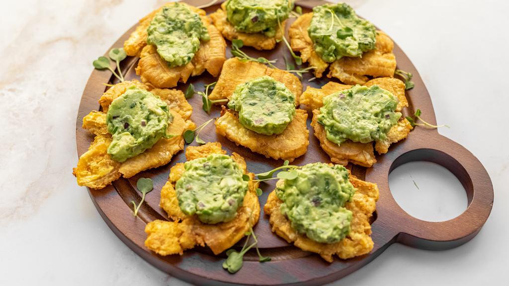 TOSTONES WITH GUACAMOLE (8 PIECES) · Green Plantain Tostones Topped With Fresh Guacamole.