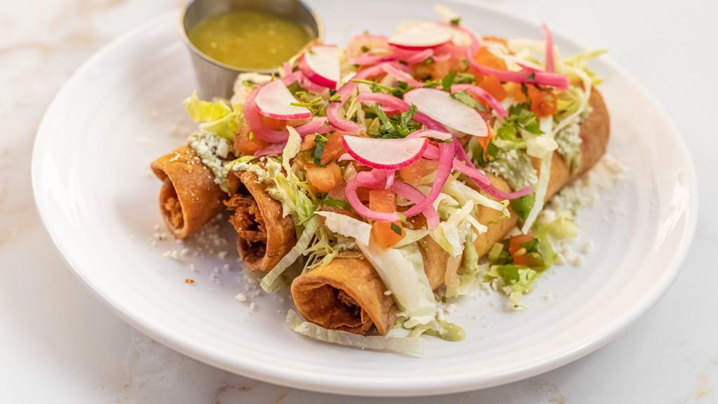 CHICKEN FLAUTAS (3) · Perfectly Crispy Corn Tortillas Rolled With Chicken Topped With Fresh Avocado Cream, Cotija Cheese, Pico De Gallo, Pickled Onions & Radishes. Salsa On The Side.