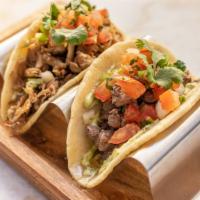 TACOS   (2) · Soft Handmade Organic Corn Tortilla Tacos Topped With Your Favorite Protein, Fresh Pico De G...