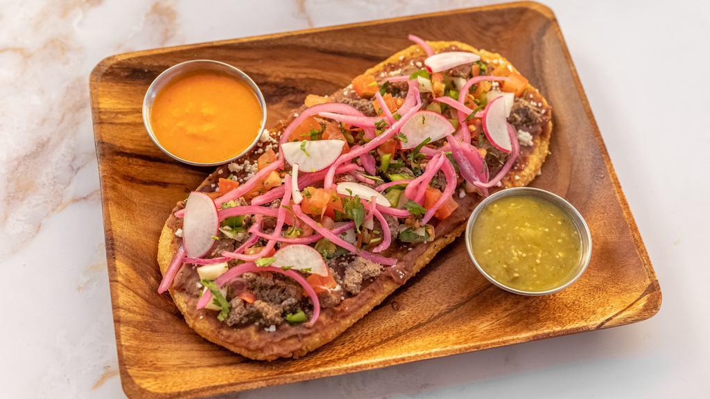 HUARACHES · Huaraches Are A Handmade, Crispy, Oblong Organic Corn Masa Cake. Toppings Include Your Favorite Protein, Cotija Cheese, Pico De Gallo, Pickled Onions, Radishes & Cilantro. Salsa On The Side.