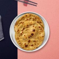 Roti · Whole wheat Indian bread cooked in a clay oven.