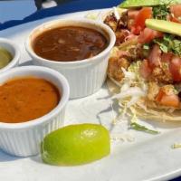 Tacos · Two tacos on corn tortilla, with Napa cabbage, chipotle aioli. tomato, avocado, on side: bla...