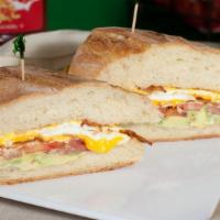 $ Breakfast Sandwich · Served with choice of meat (Bacon ,Sausage,turkey,hot link or  ham )with eggs, avocado, toma...