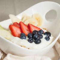 Granola Yogurt & Fruits · Granola yogurt and fresh strawberries banana and blueberries.