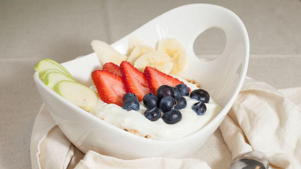 Granola Yogurt & Fruits · Granola yogurt and fresh strawberries banana and blueberries.