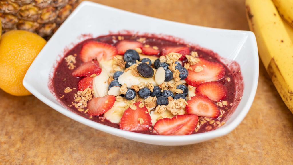 Acai granola berry bowl  · fresh strawberries ,banana , blueberries on top with granola ,honey and  Acai pure