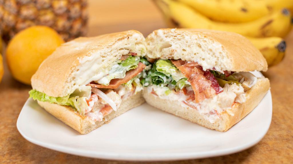 Chicken Bacon Avocado Sandwich · Slice chicken breast with  Avocado tomato, onions ,pickles  mayo and mustard served with Your choice of bread  Ciabatta or Dutch crunch