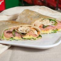 Smoked Salmon Wrap · fresh smoked Salmon with Lemon dill mayonnaise, caper, onions, tomatoes, avocado on spinach