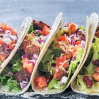Baja-Style Shrimp Tacos with Rice & Beans · Two soft corn tortilla tacos stuffed with grilled shrimp, crisp cabbage, aromatic rice and d...
