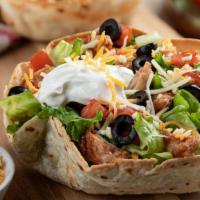 Chicken Taco Salad · Fresh chicken with a bed of romaine, rice, beans, fresh salsa, guacamole, cheeses and sour c...