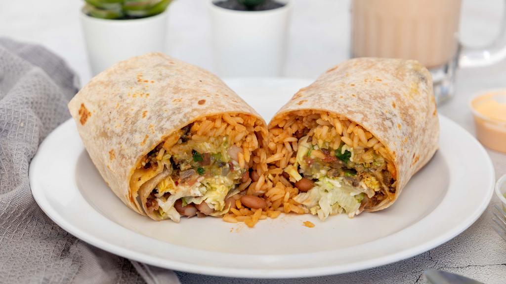 Jumbo Burrito · Meat, rice, beans, cheese, lettuce, sour cream, guacamole, & pico de gallo.