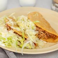 Crispy Taco · Crispy corn tortilla with chicken or beef, lettuce, cheese and & sour cream.