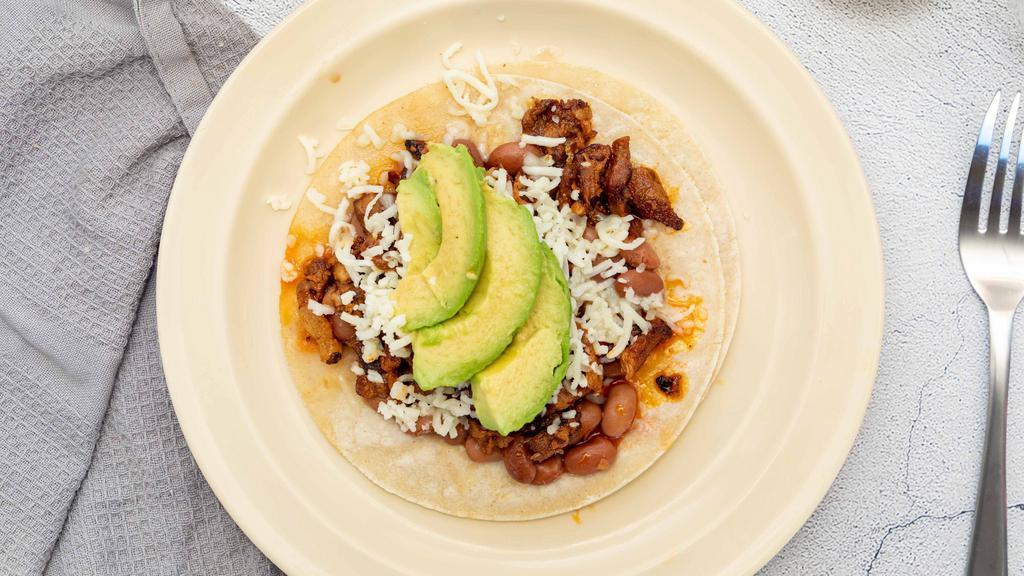 Super Taco · Meat, beans, cheese, avocado.