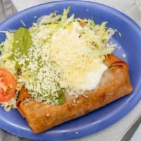 Chimichanga · Meat and beans served with lettuce, guacamole, sour cream, and cheese.