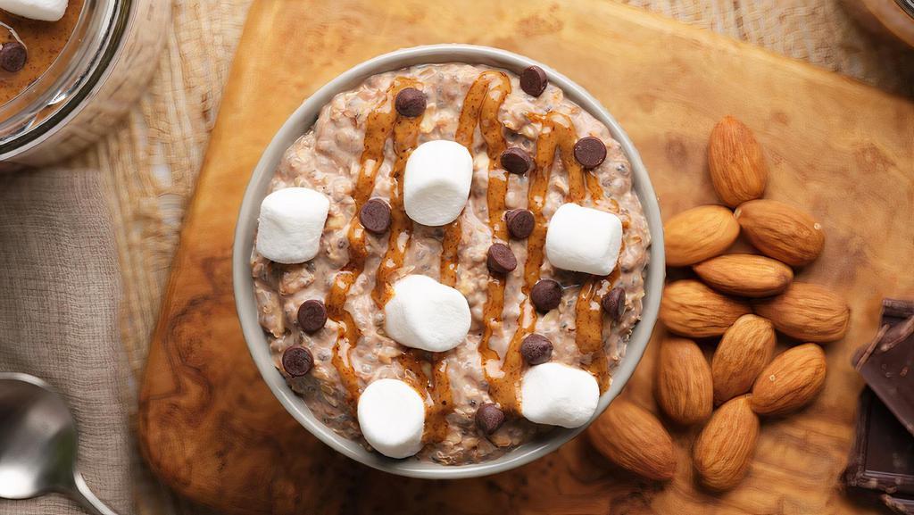 Rocky Road (10 Oz Jar) · Dairy free, vegan, gluten free. GMO-free.  Almond butter, vegan marshmallows, and chocolate chips over a blend of organic rolled oats and chia seeds soaked overnight in cashew milk.